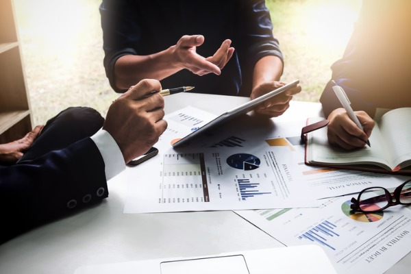 group of coworkers discussing financial strategy