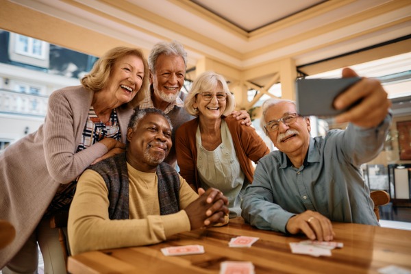 smiling retirees take selfie