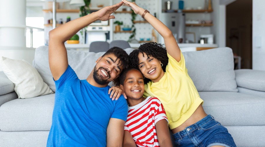 family covering heads like roof