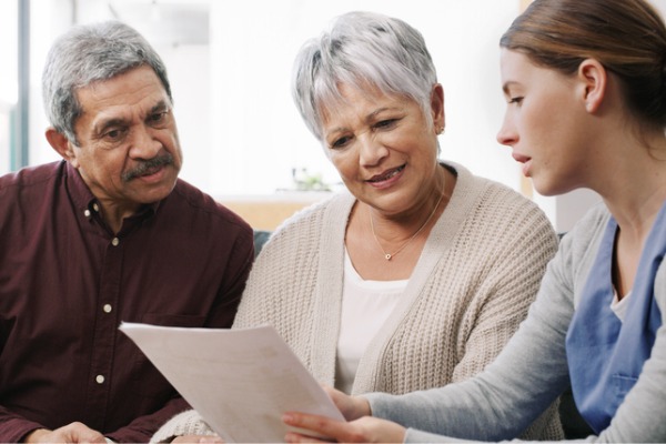 mature couple reviewing medicare forms