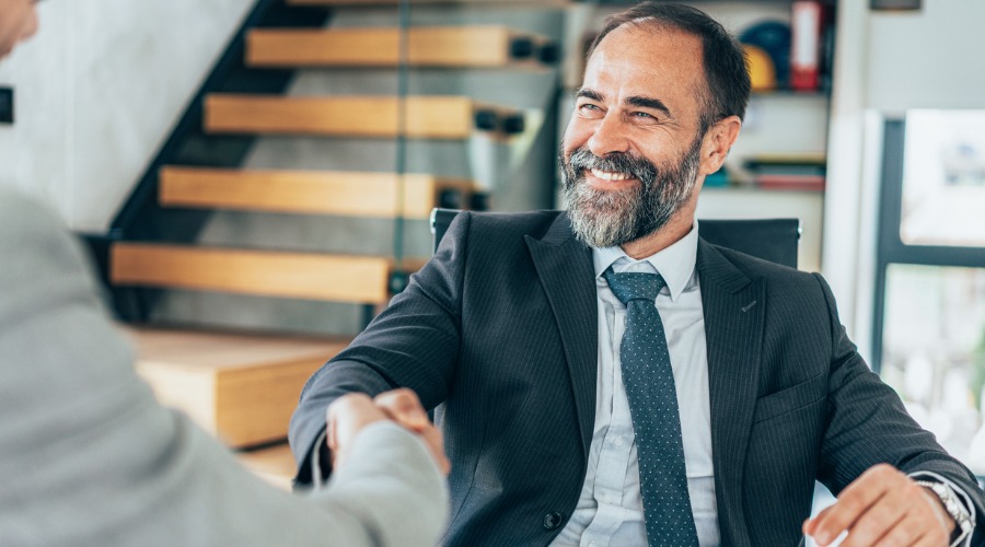 businessman shaking hand of client